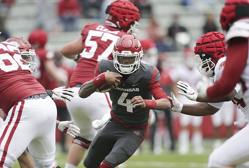 Arkansas quarterback Malik Hornsby (4) carries the ball, Saturday, April 17, 2021 during the second quarter of the Red-White spring football game at Razorback Stadium in Fayetteville. Check out nwaonline.com/210418Daily/ for today's photo gallery. .(NWA Democrat-Gazette/Charlie Kaijo)