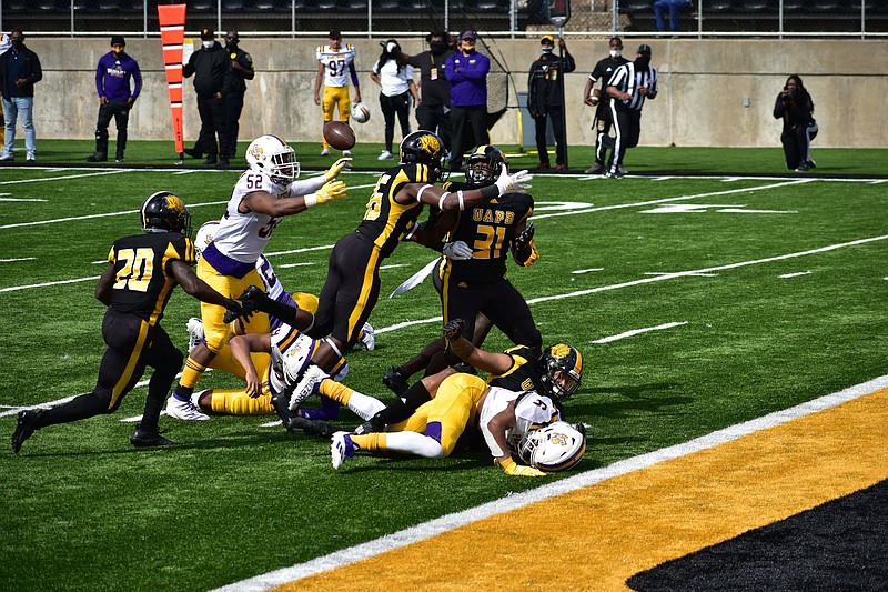 UAPB special teams players Lavonski Williams (20), Chris Newton (36) and Isaiah Singleton (31) tracked down a loose ball on a blocked Prairie View A&M punt near the goal line early in the second quarter Saturday at Simmons Bank Field. Daryl Carter blocked and recovered the punt. 
(Pine Bluff Commercial/I.C. Murrell)
