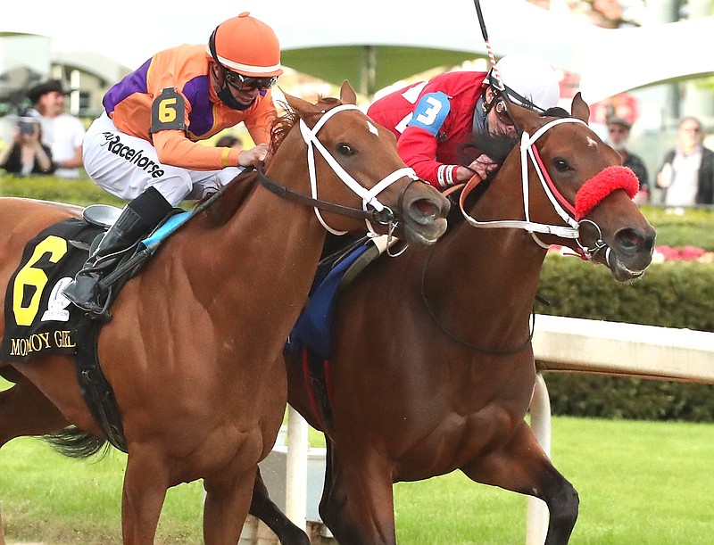 Jockey Irad Ortiz Jr., and Letruska (3), right, put a head in front of Jockey Florent Geroux and Monomoy Girl (6) at the wire to win the Apple Blossom Handicap Saturday, April 17, 2021, at Oaklawn Racing Casino Resort. Photo by Richard Rasmussen of The Sentinel-Record