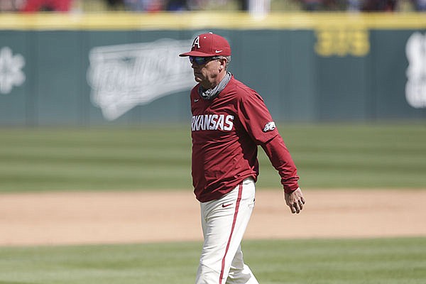 Arkansas coach Dave Van Horn walks toward the dugout during a game against Texas A&M on Sunday, April 18, 2021, in Fayetteville.