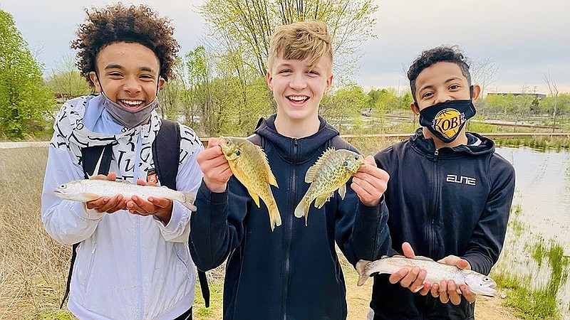 Bentonville anglers show off their catches in this file photo. 
(Special to The Commercial/Arkansas Game and Fish Commission)