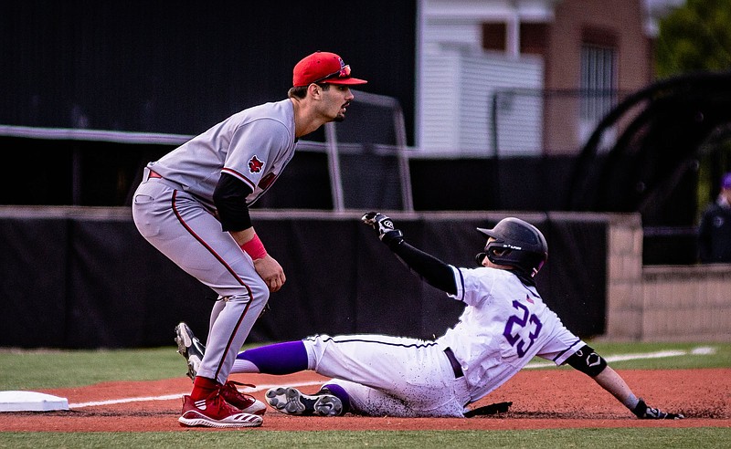 Drew Sturgeon of Central Arkansas slides safely into third base in front of Arkansas State third baseman Ben Klutts during the Bears’ victory over the Red Wolves on Tuesday in Conway. (UCA Athletics/Jaden Powell)