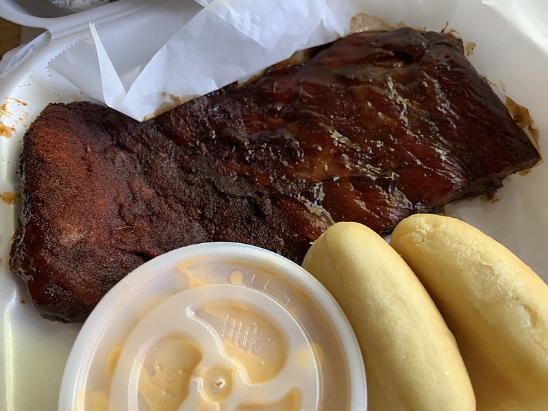 Our half-slab of ribs from Corky's was half "dry" and half "wet," with mac & cheese as one of the two side items. (Arkansas Democrat-Gazette/Eric E. Harrison)