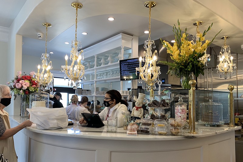 Chandeliers are part of the decor at the order counter of the newly opened Two Sisters, 201 N. Izard St., Little Rock. (Democrat-Gazette file photo/Eric E. Harrison)