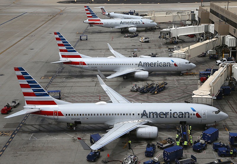 American jetliners are parked at Phoenix Sky Harbor International Airport in this July file photo. American Airlines Group Inc. reported a loss of $1.25 billion in its first quarter.
(AP)