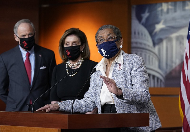 Del. Eleanor Holmes-Norton (right), D-D.C., joined by Sen. Tom Carper, D-Del., and House Speaker Nancy Pelosi, D-Calif., speaks at a Capitol Hill news conference Thursday ahead of the House vote on H.R. 51 — the Washington, D.C. Admission Act.
(AP/J. Scott Applewhite)