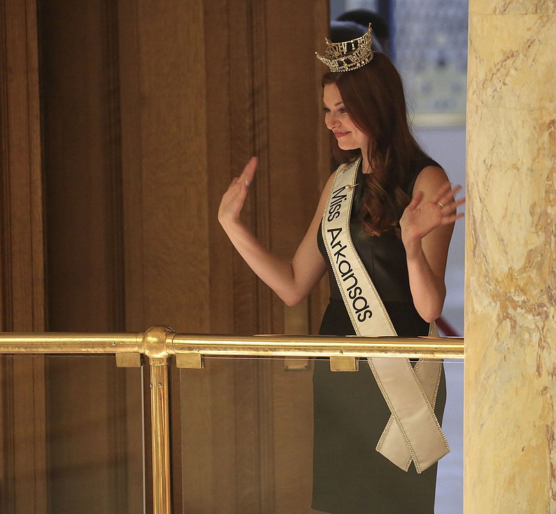 Miss Arkansas Darynne Dahlem waves Thursday from the House gallery after being introduced and honored with a House Resolution, HR1044.
(Arkansas Democrat-Gazette/ Staton Breidenthal)