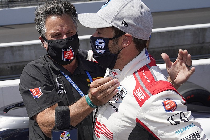 Marco Andretti is congratulated by his father Michael Andretti after Marco won the pole for the Indianapolis 500 last year. Michael, the owner of Andretti Autosport, has expressed optimism for the organization following a 2020 season in which it had one victory.
(AP file photo)