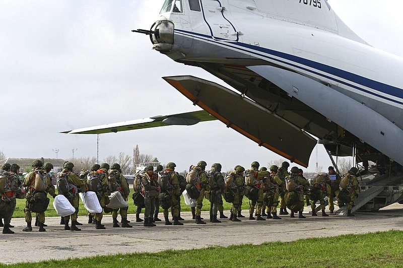 Russian paratroopers load into a plane for airborne drills during maneuvers in Taganrog, Russia, Thursday, April 22, 2021. (AP)