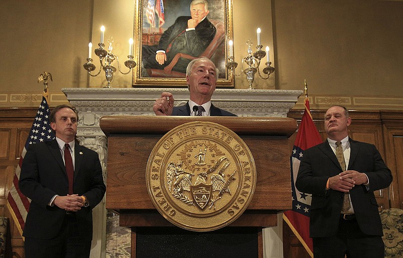 Gov. Asa Hutchinson said Thursday that officials expect to be able to fully fund the state’s proposed $5.84 billion budget in fiscal 2022, a plan that he said is $50 million less than what the state budgeted for in fiscal 2021. With the governor are House Speaker Rep. Matthew Shepherd (left) and Senate President Sen. Jimmy Hickey. More photos at arkansasonline.com/423revenue/.
(Arkansas Democrat-Gazette/Staton Breidenthal)