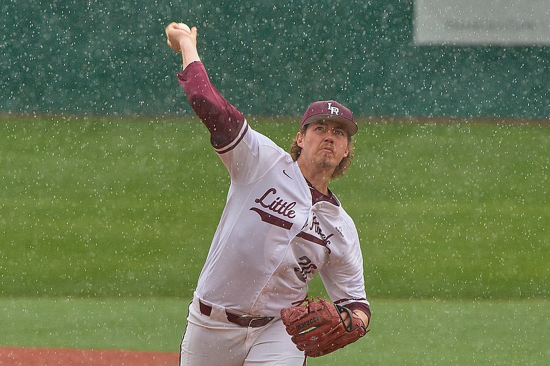 UALR’s Hayden Arnold delivers a pitch in a rain shower Friday during the Trojans’ victory over Louisiana-Lafayette at Gary Hogan Field in Little Rock. Arnold allowed 2 runs and struck out 8 over 6 innings.
(Photo courtesy of UALR Athletics)