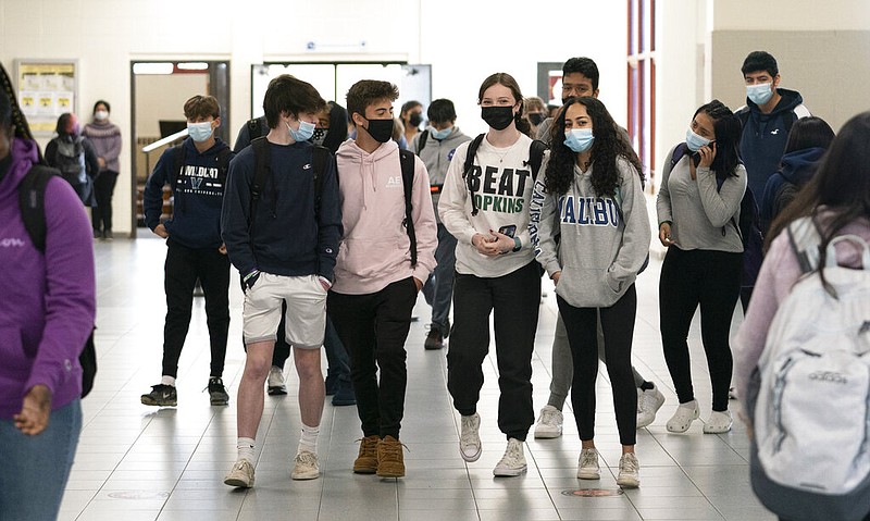 White Plains (N.Y.) High School students walk between classes on Thursday, April 22, 2021. The school in White Plains reopened to all students on April 12, and U.S. Education Secretary Miguel Cardona visited it as part of the "Help is Here" tour. (AP/Mark Lennihan)