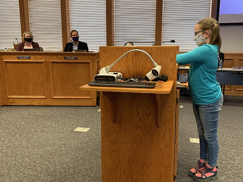 Stella Johnson, fourth-grader, shares her experience as a Fayetteville Virtual Academy student Thursday with the School Board. (NWA Democrat-Gazette/Mary Jordan)