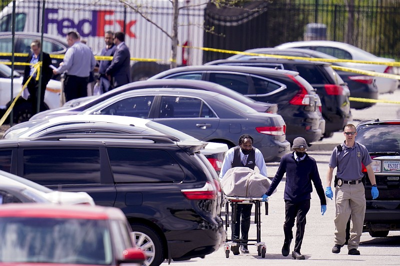 A body is taken from the scene where multiple people were shot at a FedEx Ground facility in Indianapolis on April 16. A gunman killed several people and wounded others before taking his own life in a late-night attack at a FedEx facility near the Indianapolis airport, police said.
(AP/Michael Conroy)