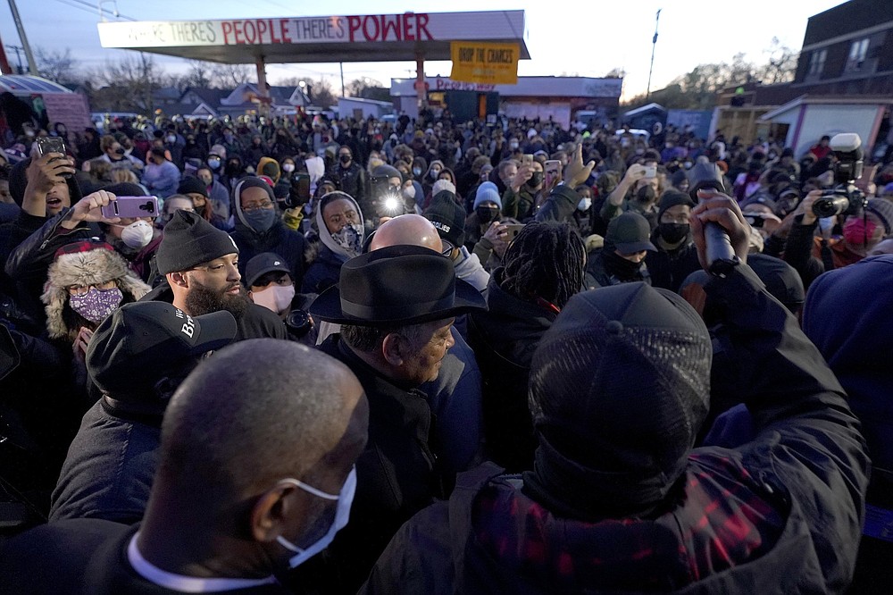 The Rev. Jesse Jackson (center) walks with his security detail at George Floyd Square after a guilty verdict was announced at the trial of former Minneapolis police Officer Derek Chauvin for the 2020 death of Floyd on Tuesday in Minneapolis. Chauvin has been convicted of murder and manslaughter in Floyd’s death.
(AP/Julio Cortez)