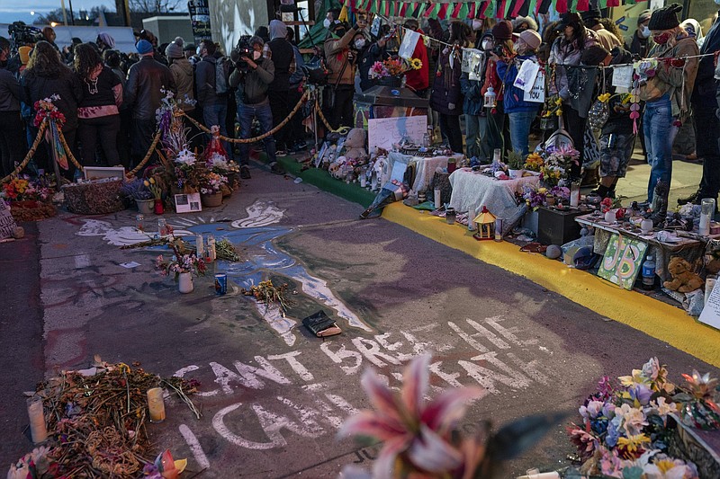 Demonstrators gather around the pavement where George Floyd was murdered outside Cup Foods on May 25 to celebrate the conviction Tuesday of former Minneapolis police officer Derek Chauvin in his death in Minneapolis.
(AP/John Minchillo)