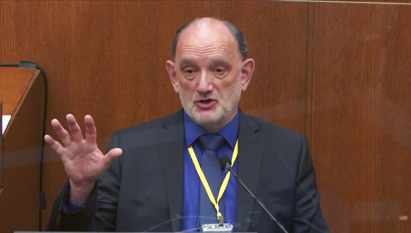 In this image from video, Dr. David Fowler, a retired forensic pathologist and former chief medical examiner for the state of Maryland, testifies Wednesday, April 14, 2021, in the trial of former Minneapolis Police Department Officer Derek Chauvin at the Hennepin County (Minn.) Courthouse in Minneapolis. (Court TV via AP, Pool)