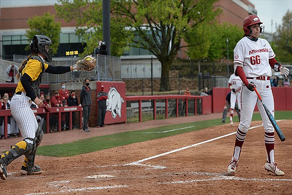Arkansas right fielder Aly Manzo (66) and Missouri catcher Hatti Moore (left) react Saturday, April 24, 2021, after Manzo struck out with two on base to end the sixth inning of the Razorbacks' 6-4 loss at Bogle Park in Fayetteville. Arkansas right fielder Aly Manzo (66) and Missouri catcher Hatti Moore (left) react Saturday, April 24, 2021, after Manzo struck out with two on base to end the sixth inning of the Razorbacks' 6-4 loss at Bogle Park in Fayetteville.