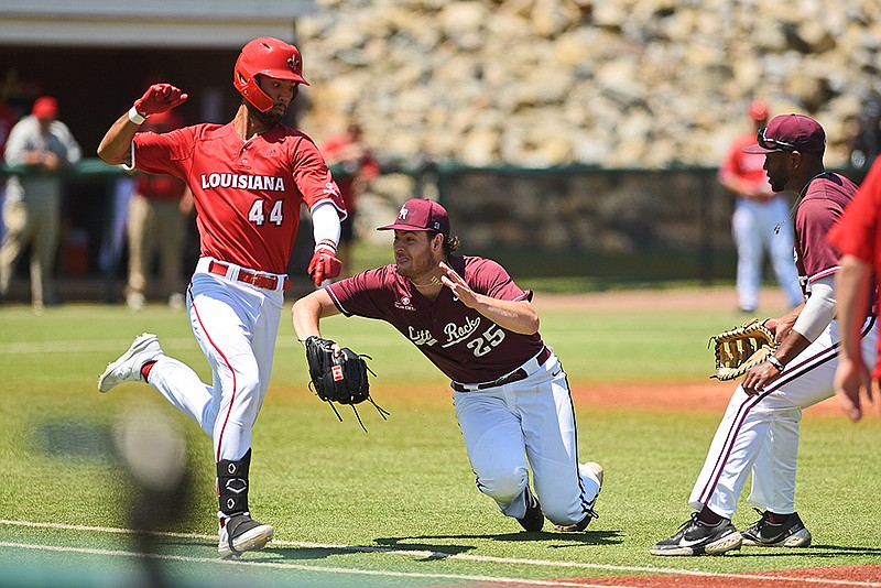 Little Rock Trojans’ Jack Decooman (right) attempts to tag out Louisiana’s CJ Willis during the fourth inning of Sunday’s game at Gary Hogan Field in Little Rock. More photos available at arkansasonline.com/426ualr/..(Arkansas Democrat-Gazette/Staci Vandagriff)