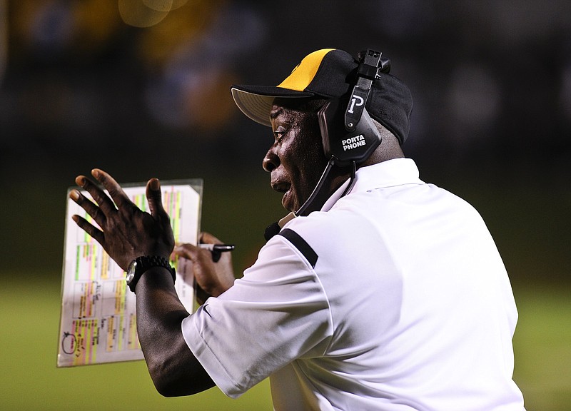 Watson Chapel Head Football Coach George Shelton encourages his players during the first quarter of the Hootens.com Kickoff Classic at UAPB's Golden Lions Stadium in Pine Bluff...Special to the Arkansas Democrat Gazette/Jimmy Jones
