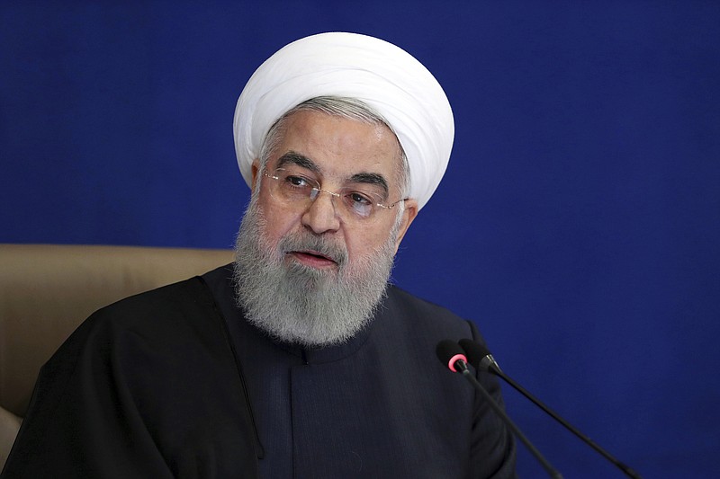 In this photo released by the official website of the office of the Iranian Presidency, President Hassan Rouhani speaks in a meeting in Tehran, Iran, on Dec. 9, 2020. The Biden administration is weighing a near wholesale rollback of some of the most stringent Trump-era sanctions imposed on Iran, in a bid to get the Islamic Republic to return to compliance with a landmark 2015 nuclear accord. (Iranian Presidency Office via AP)