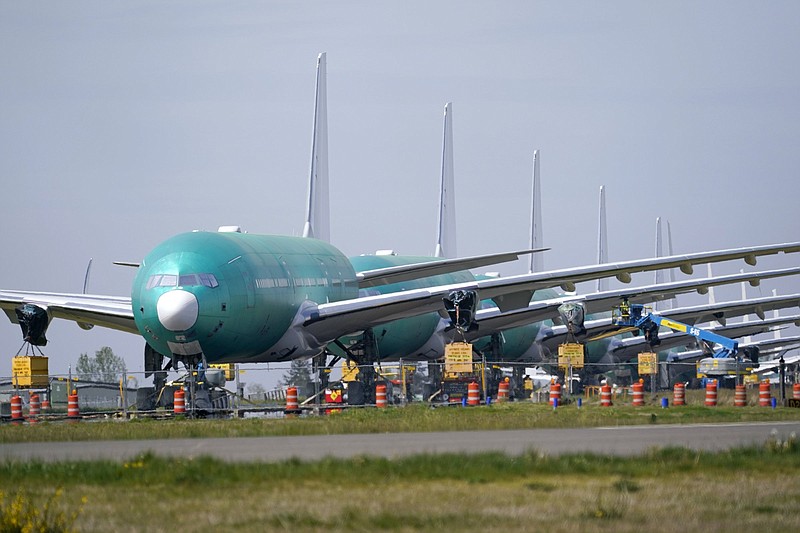 Boeing 777X jets sit parked Friday on an unused runway at Paine Field, near Boeing’s production facility in Everett, Wash. Boeing on Wednesday reported a loss of $537 million in its first quarter.
(AP/Elaine Thompson)