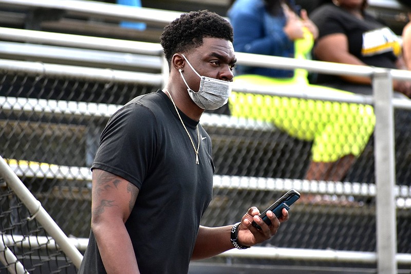 Former UAPB quarterback Ben Anderson watches an April 17, 2021, game against Prairie View A&M from the bleachers at Simmons Bank Stadium. Anderson played quarterback at UAPB from 2011-14. (Pine Bluff Commercial/I.C. Murrell)