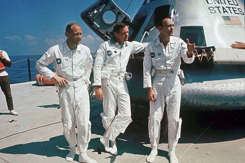 Michael Collins (right), the Apollo 11 command module pilot, orbited the moon while astronauts Edwin “Buzz” Aldrin (left) and Neil Armstrong became the first men to walk on the moon in July 1969.
(AP)