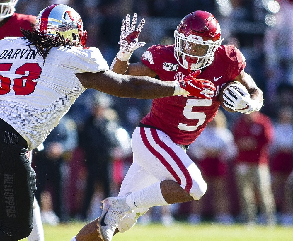 Running back Rakeem Boyd (5) averaged 6.0 yards per carry for Arkansas in 2018 and 2019, but he dropped to 3.8 ypc last season before opting out with two games remaining. CBSSports projects him as a seventh-round draft pick.
(Special to the NWA Democrat-Gazette/David Beach)