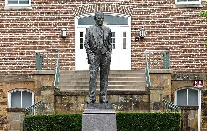The family of former U.S. Sen. J. William Fulbright has asked the University of Arkansas board of trustees to allow Fulbright’s statue, shown in July near the west entrance of Old Main on the Fayetteville campus, to remain despite an effort to have it and Fulbright’s name removed from campus. (NWA Democrat-Gazette/Andy Shupe)