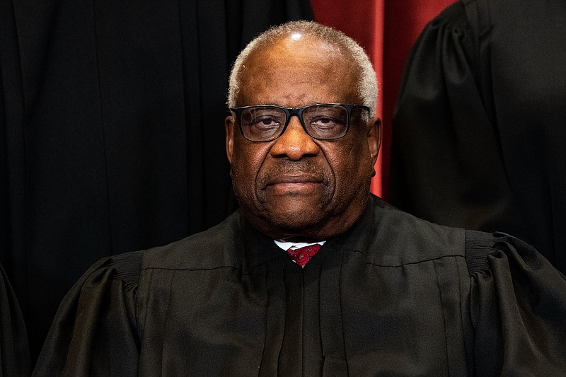 Associate Justice Clarence Thomas sits for a group photo of the justices, at the Supreme Court building in Washington, April 23, 2021. (Erin Schaff/The New York Times)