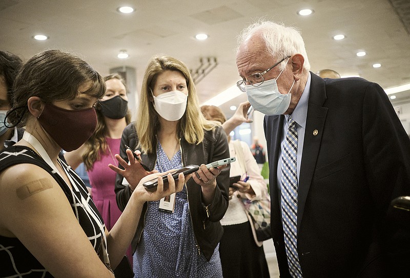 Sen. Bernie Sanders talks with reporters on his way to a vote Thursday in the Senate. Sanders said Wednesday that he would “absolutely” pursue a sizable expansion of Medicare.
(The New York Times/T.J. Kirkpatrick)