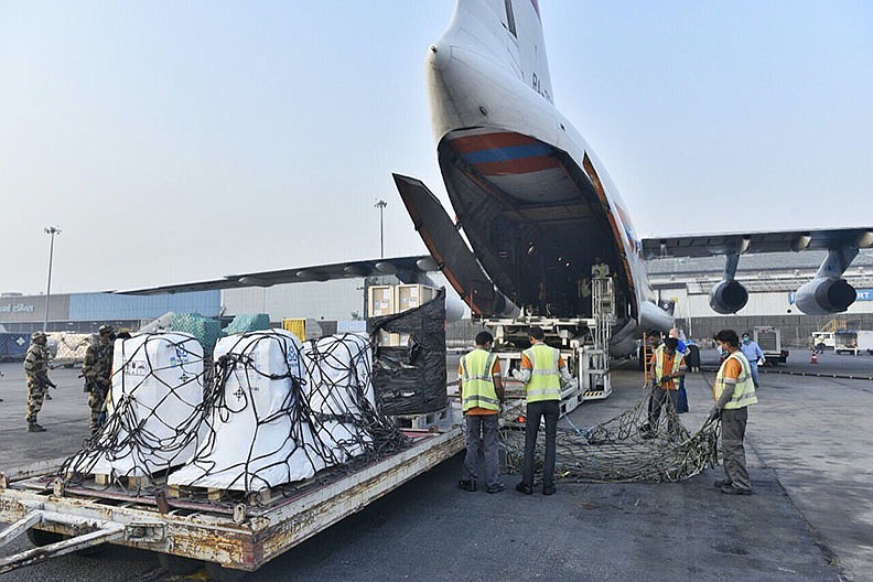 A shipment of oxygen concentrators, ventilators and other medical supplies that arrived from Russia is unloaded Thursday at an airfield in India.
(AP/Indian External Affairs Ministry)