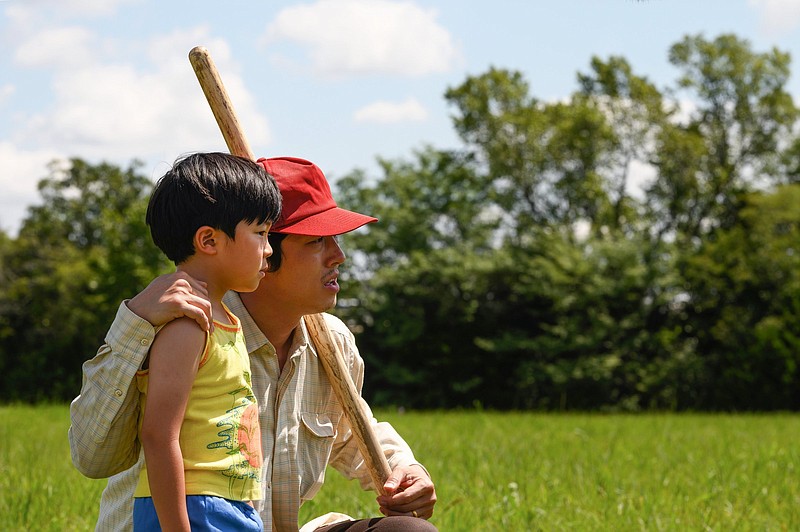 Alan Kim and Steven Yeun star in “Minari,” Lee Isaac Chung’s film about growing up in rural Arkansas.