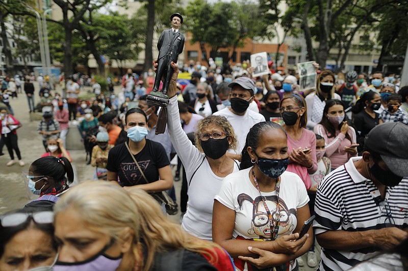 People gather Friday outside the church associated with the late Dr. Jose Gregorio Hernandez during his beatification ceremony in Caracas, Venezuela. He was known as the “doctor of the poor.”
(AP/Ariana Cubillos)