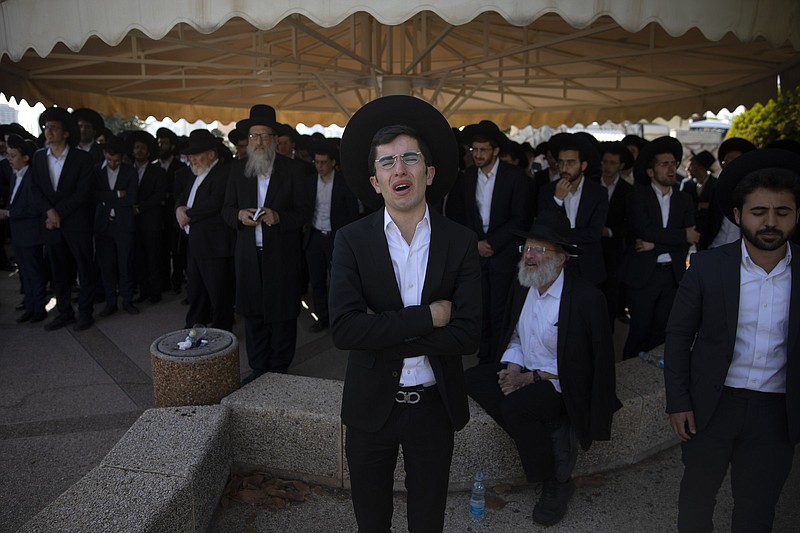Ultra-Orthodox Jews mourn Friday during the funeral for Moshe Ben Shalom at a cemetery in Petah Tikva, Israel. He and several others died early Friday during a stampede at Lag BaOmer celebrations in northern Israel.
(AP/Oded Balilty)