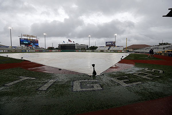 A tarp covers the field during a rain delay before an NCAA college regional baseball game between Utah Valley and LSU in Baton Rouge, La., Friday, June 3, 2016. (AP Photo/Gerald Herbert) A tarp covers the field during a rain delay before an NCAA college regional baseball game between Utah Valley and LSU in Baton Rouge, La., Friday, June 3, 2016. (AP Photo/Gerald Herbert)