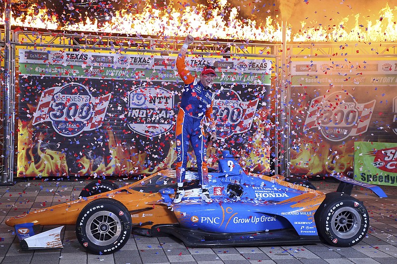 Scott Dixon celebrates in victory lane after winning Saturday night’s IndyCar Series race at Texas Motor Speedway in Fort Worth. The series returns to the track today.
(AP/Richard W. Rodriguez)