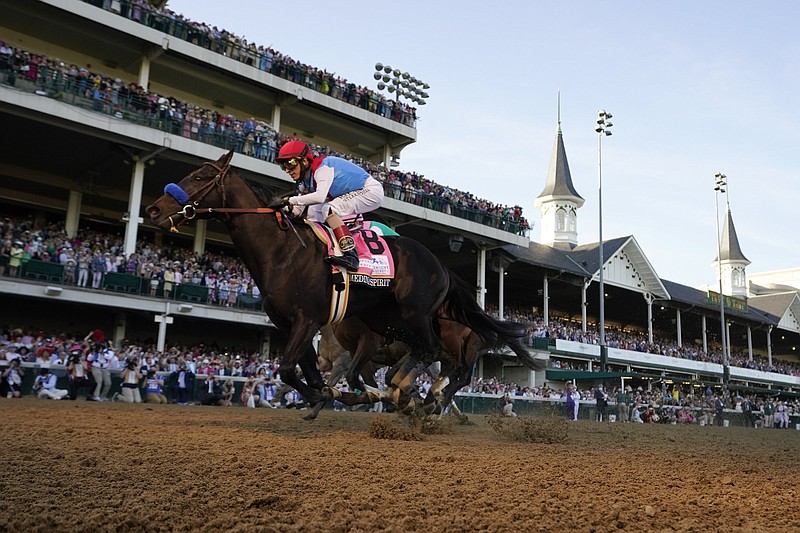 Medina Spirit and jockey John Velazquez cross the fi nish line to win the 147th Kentucky Derby on Saturday at Churchill Downs in Louisville, Ky. It was Velazquez’s fourth Derby victory and the record seventh for trainer Bob Baffert. More photos available at arkansasonline.com/52derby.
(AP/Jeff Roberson)