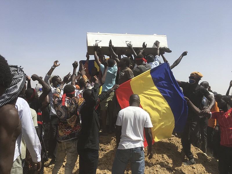 Mourners chant Saturday in N’Djamena, Chad, as they move the coffin of someone killed last week during anti-government demonstrations.
(AP/Sunday Alamba)