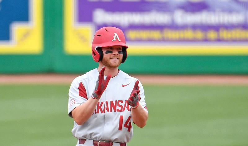Arkansas senior Cullen Smith reacts after hitting an RBI double in the first inning of the Razorbacks’ victory over LSU in the fi rst game of a doubleheader Saturday in Baton Rouge. Arkansas clinched its seventh consecutive SEC series victory this season.
(The Advocate/Hilary Scheinuk)