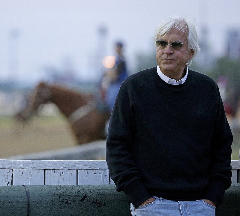 FILE - In this May 3, 2016, file photo, trainer Bob Baffert watches a workout at Churchill Downs in Louisville, Ky. (AP Photo/Charlie Riedel, File)
