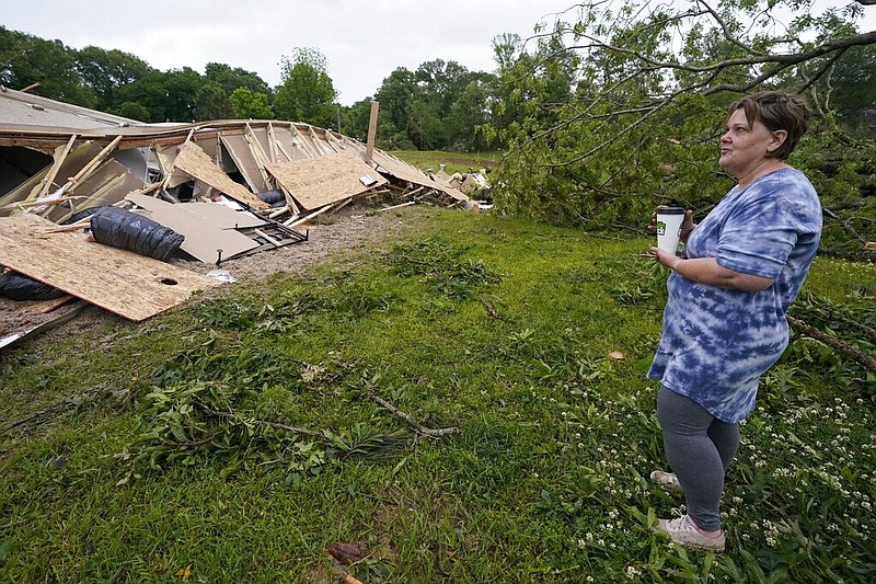 Vickie Savell looks at the remains of her new mobile home early Monday, May 3, 2021, in Yazoo County, Miss. (AP/Rogelio V. Solis)