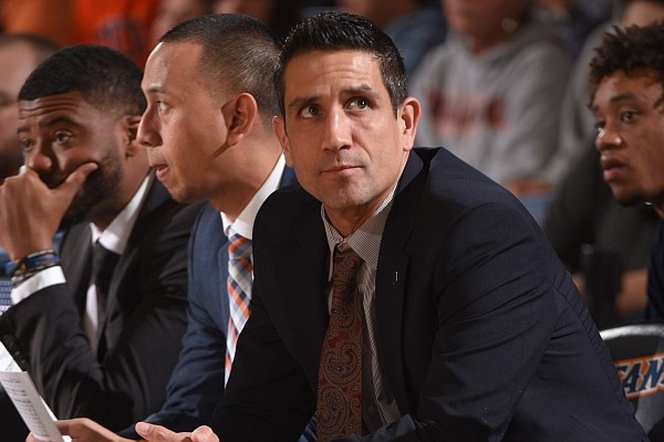 Former Cal State Fullerton associate head coach and current Arkansas assistant coach Gus Argenal looks toward the action during a game against UC Davis on Feb. 8, 2020.