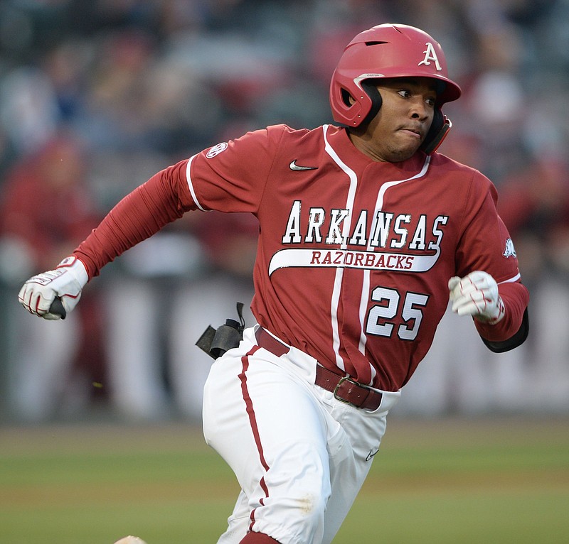 Arkansas center fielder Christian Franklin heads to first Saturday, March 20, 2021, after hitting a double to left field against Alabama during the fourth inning of play at Baum-Walker Stadium in Fayetteville Visit nwaonline.com/210321Daily/ for today's photo gallery. .(NWA Democrat-Gazette/Andy Shupe)