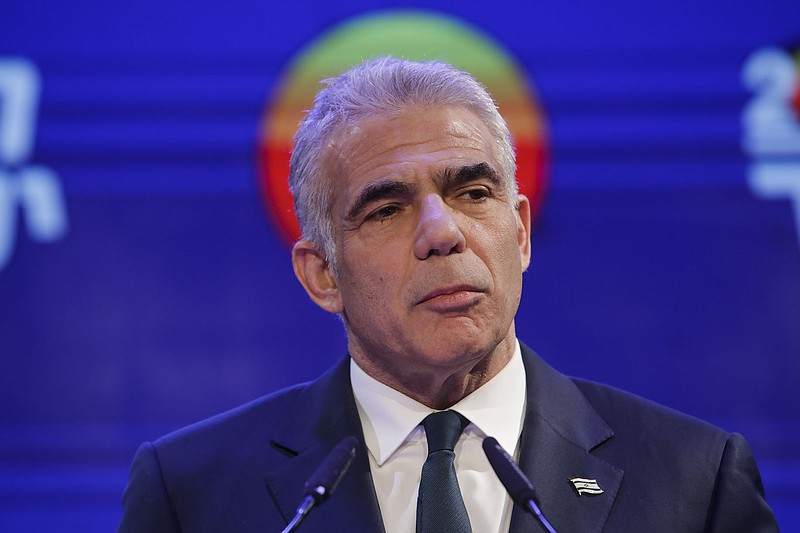 Yesh Atid party leader Yair Lapid speaks to his supporters after first exit poll results for the Israeli Parliamentary election at his party's headquarters in Tel Aviv, Israel, Wednesday, March. 24, 2021. (AP Photo/Sebastian Scheiner)