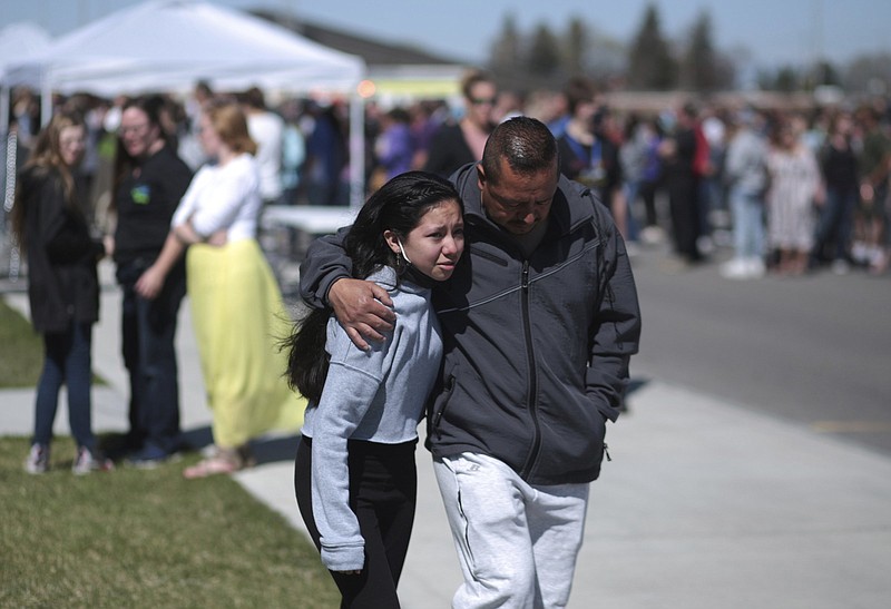 People embrace Thursday after a school shooting at Rigby Middle School in Rigby, Idaho.
(AP/The Idaho Post-Register/John Roark)