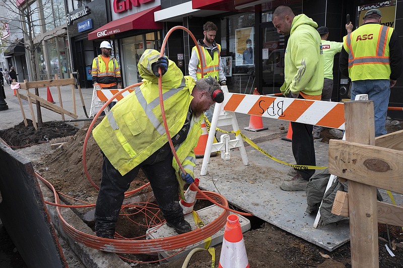 Workers install conduit last month that will hold Verizon’s fiber-optic cable in New York. U.S. productivity posted a sharp rebound in the January-March quarter after having fallen in the previous quarter.
(AP/Mark Lennihan)