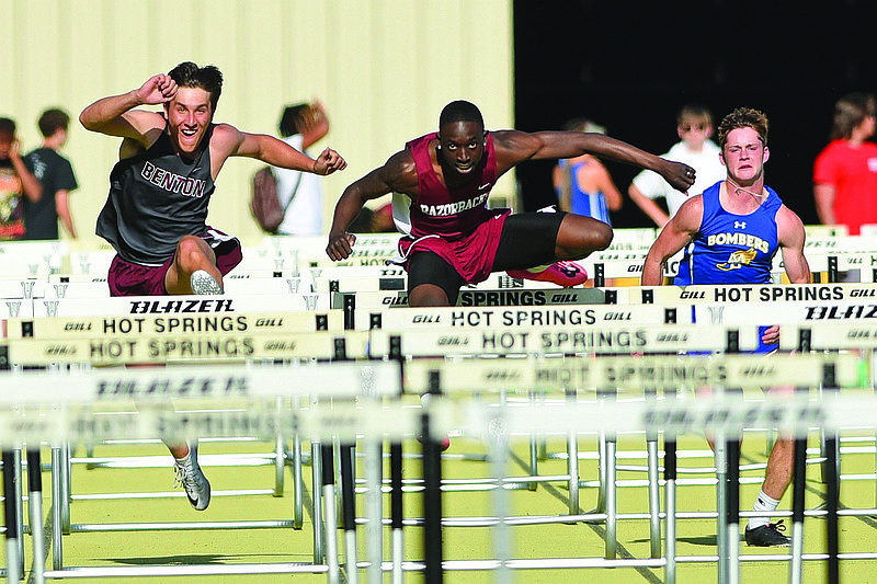 Texarkana’s Jamarious Johnson won the boys 110-meter hurdles Thursday at Class 5A state track and field meet in Hot Springs in a time of 14.50 seconds. He also won the 300 hurdles, helping the Razorbacks claim the boys team title. More photos available at arkansasonline.com/57track5a.
(Arkansas Democrat-Gazette/Staci Vandagriff)