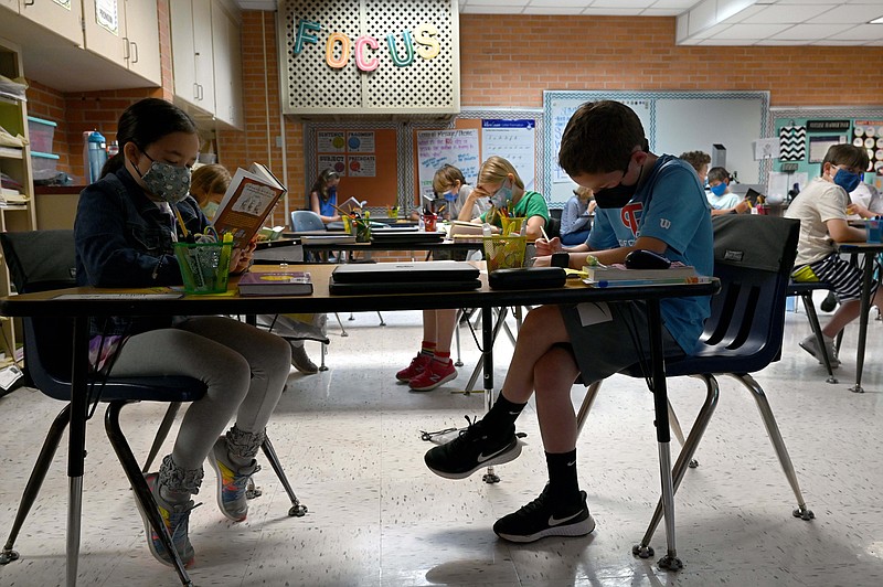 Kids read books during class at Jefferson Elementary on Tuesday, May 4, 2021. (Arkansas Democrat-Gazette/Stephen Swofford)